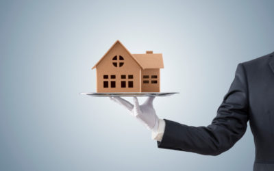 Man holding a house model